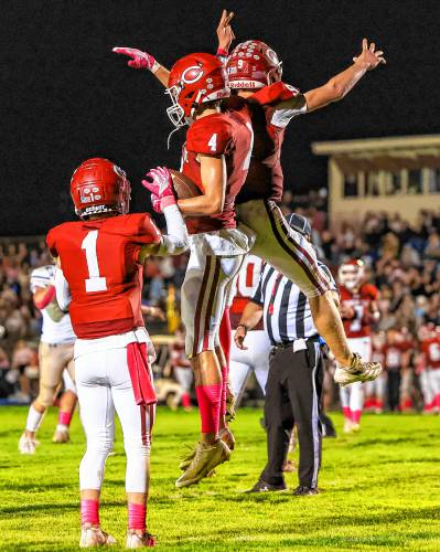 Wide receiver Brett Tuttle celebrates a 38-yard touchdown with quarterback Colby Nyhan after taking a 14-7 lead before halftime on Friday night.