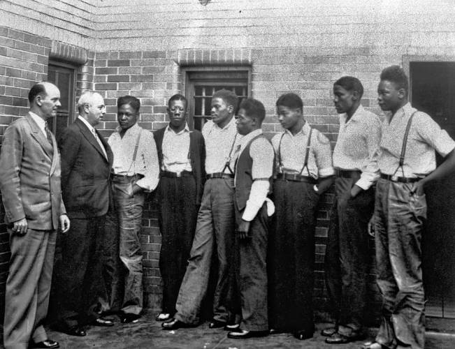 In this May 1, 1935, file photo, New York attorney Samuel Leibowitz, second left, meets with seven of the Scottsboro defendants at the jail in Scottsboro, Ala., just after he asked the governor to pardon the nine youths held in the case. From left are Deputy Sheriff Charles McComb, Leibowitz and defendants Roy Wright, Olen Montgomery, Ozie Powell, Willie Robertson, Eugene Williams, Charlie Weems and Andy Wright. In this May 1, 1935, file photo, New York attorney Samuel Leibowitz, second left, meets with seven of the Scottsboro defendants at the jail in Scottsboro, Ala., just after he asked the governor to pardon the nine youths held in the case. From left are Deputy Sheriff Charles McComb, Leibowitz and defendants Roy Wright, Olen Montgomery, Ozie Powell, Willie Robertson, Eugene Williams, Charlie Weems and Andy Wright.