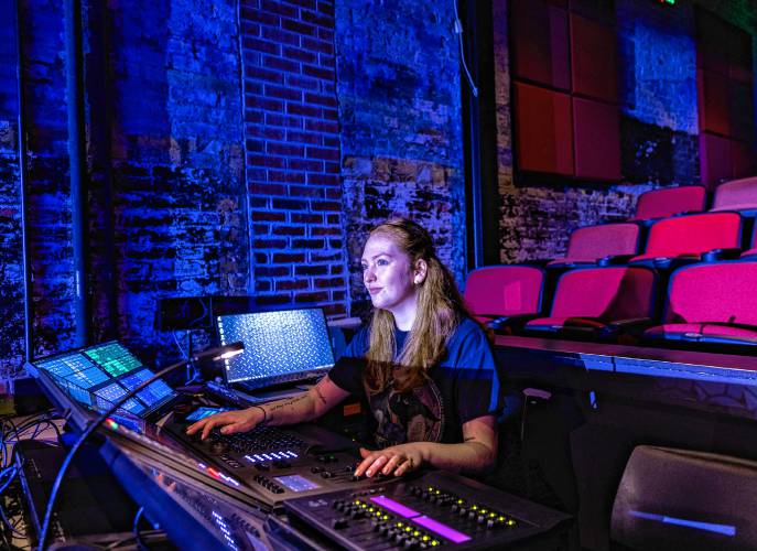 Erin works the lighting board at the New Hampshire Stage in downtown Concord on  Jan. 31.
