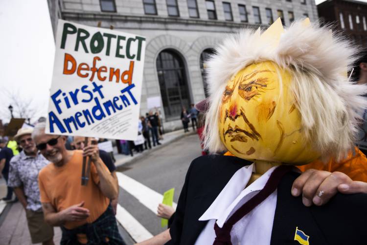 There were many depictions of President Trump at the âHands Offâ protest in front of the State House on Saturday, April 19, 2025.