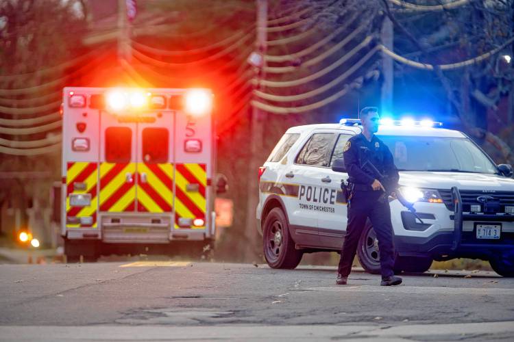 A police officer stands on Clinton Street after a shooting at the New Hampshire Hospital on Friday afternoon, November 17, 2023.