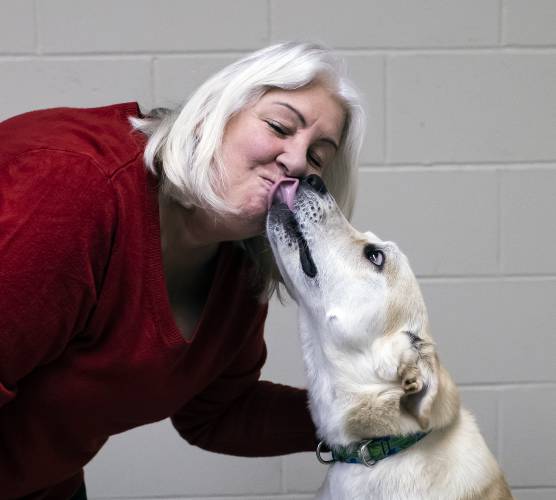 Cathy Emerson, director of operations at the Pope Memorial SPCA, spends some time with Harriet, who is up for adoption. Emerson is retiring at the end of the month after over 30 years at the organization.