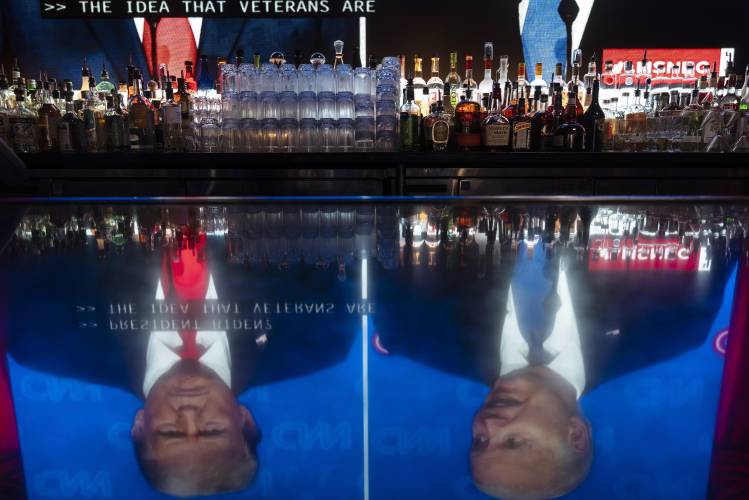 Liquor bottles are placed on a back bar at the Abbey Food & Bar in West Hollywood, Calif., Thursday, June 27, 2024, as a presidential debate between President Joe Biden and Republican presidential candidate, former President Donald Trump, is broadcast. (AP Photo/Jae C. Hong)