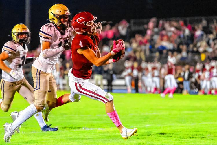 Wide receiver Brett Tuttle catches a 38-yard touchdown pass from quarterback Colby Nyhan, giving Concord a 14-7 lead before halftime on Friday night. 