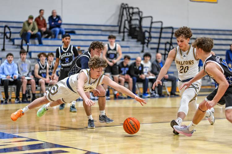 Bow’s Ben Reardon (left) and Dylan Oosterveen (20) dive for a loose ball during a boys' basketball game against Hollis-Brookline on Tuesday. Hollis-Brookline defeated Bow, 53-40. Bow’s Ben Reardon (left) and Dylan Oosterveen (20) dive for a loose ball during a boys' basketball game against Hollis-Brookline on Tuesday. Hollis-Brookline defeated Bow, 53-40.