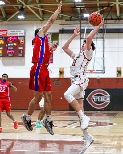 Concord’s Holden Martin (11) takes a shot during a game against Trinity on Friday. Martin, the Tide’s only senior, led Concord with 13 points on senior night. Trinity won 81-35.