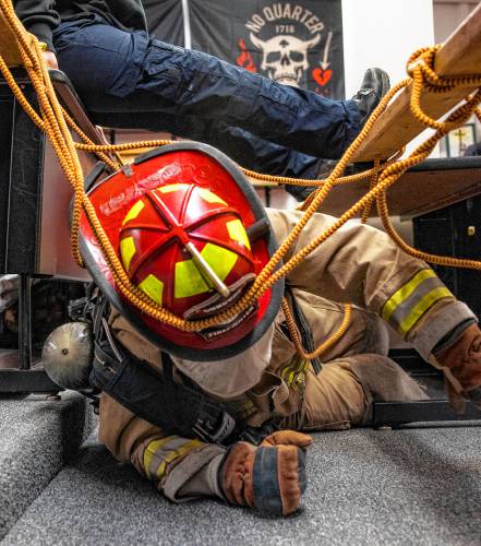 Addison “Nails” Bergeron leads the group through the obstacle course at their CRTC firefighter class at Concord High School on Thursday, March 7, 2024.