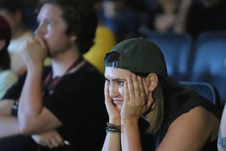 Sara Day, a supporter of President Joe Biden, watches coverage of the debate between Biden and former President Donald Trump, at Brewvies Cinema Pub on Thursday, June 27, 2024, in Salt Lake City. (AP Photo/Rick Bowmer)
