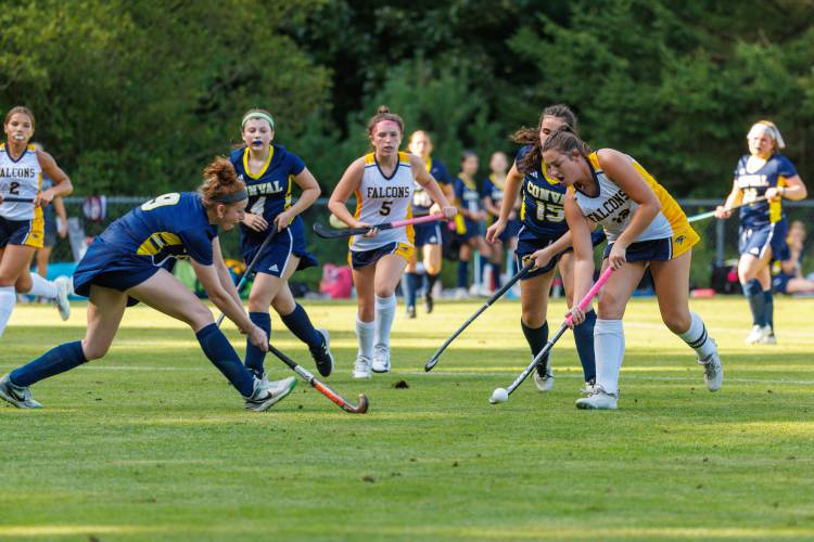 Bow senior forward and captain Ella Gray sends a leading ball past the defense to assist Josie Johnson in Friday night's win over ConVal.