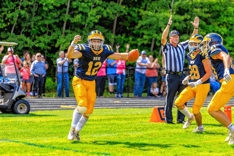 Bow quarterback Brady Lover celebrates a touchdown during the first quarter of Bow football’s season opener at home against Pelham on Saturday. Lover scored both of Bow’s touchdowns.