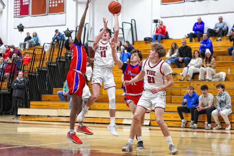Concord’s Holden Martin (11) takes a shot during a game against Trinity on Friday. Martin, the Tide’s only senior, led Concord with 13 points on senior night. Trinity won 81-35.