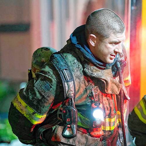 Concord Firefighter CJ Girard is shown on duty at a four-alarm fire on Rumford Street in August 2022. Girard, a father and resident of Bow, died unexpectedly this weekend. 