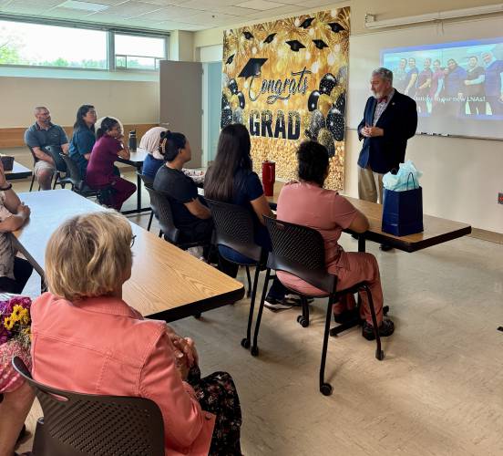 Mayor Byron Champlin speaks to the LNA students at their graduation at NHTI on Friday. He was invited by Yuhsien Wu-Riggs. 