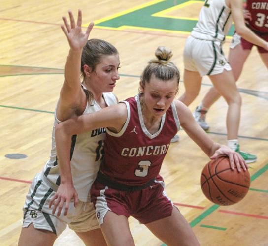 Concord’s Whitney Vaillant (3) looks to dribble around a Bishop Guertin defender during a girls’ basketball game on the road in Nashua on Friday night. Vaillant scored a team-high 11 points, but Bishop Guertin won 53-27.