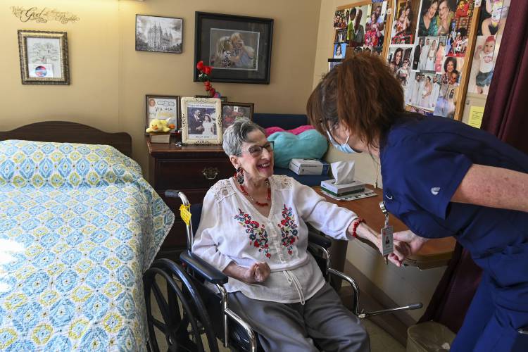 Resident Eleanor Garrison, left, talks with director of nursing Cheri Place-Chafin in her room Wednesday, Feb. 3, 2021, at Arbor Springs Health and Rehabilitation Center in Opelika, Ala.