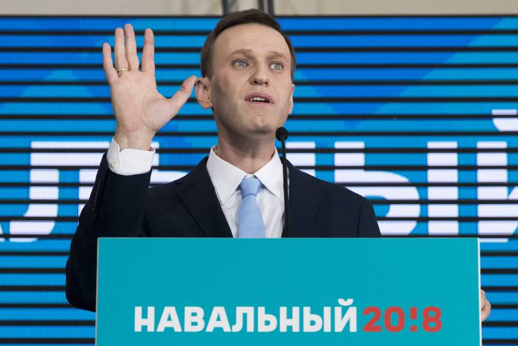 FILE - Russian opposition leader Alexei Navalny gestures while speaking during his supporters' meeting that nominated him for the presidential election race in Moscow, Russia on Dec. 24, 2017. Alexei Navalny, the fiercest foe of Russian President Vladimir Putin who crusaded against official corruption and staged massive anti-Kremlin protests, died in prison Friday Feb. 16, 2024 Russia’s prison agency said. He was 47. (AP Photo/Pavel Golovkin, File)