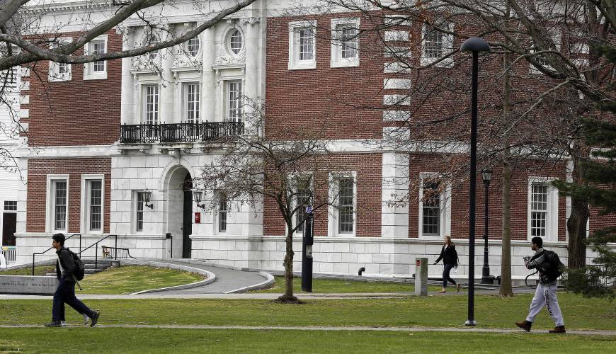 Students walk on the campus of the prestigious Phillips Exeter Academy Monday, April 11, 2016, in Exeter, N.H.