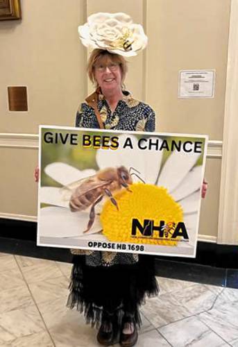 Mary Ellen McKeen, president of the N.H. Beekeepers Association, poses in the State House on Thursday. She testified against a bill that would allow pesticides to be sprayed from drones without notifying neighbors first. Mary Ellen McKeen, president of the N.H. Beekeepers Association, poses in the State House on Thursday. She testified against a bill that would allow pesticides to be sprayed from drones without notifying neighbors first.