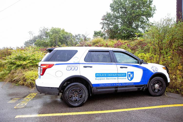 A UNH police is parked near the campus station.