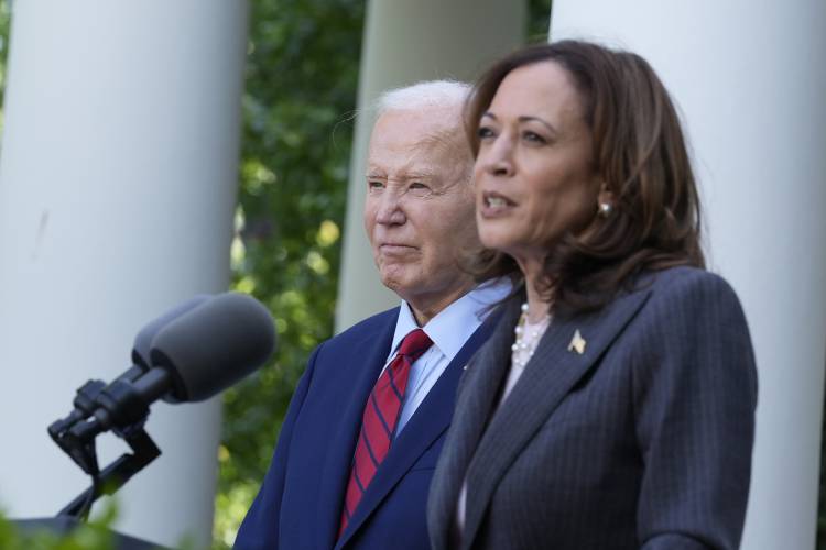 President Joe Biden listens as Vice President Kamala Harris speaks in the Rose Garden of the White House in Washington, May 13. President Joe Biden listens as Vice President Kamala Harris speaks in the Rose Garden of the White House in Washington, May 13.