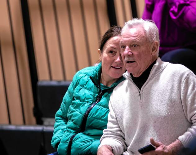 Kimberly Clark looks over the crowd at the Allenstown meeting with her father, Jim Boisvert, at the elementary school gym on Saturday morning, February 1, 2025.