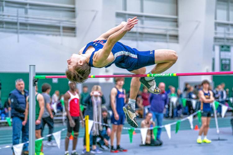 John Stark’s Rio Calle clears the high jump bar at the NHIAA Division II indoor track and field championship on Saturday at Plymouth State University.