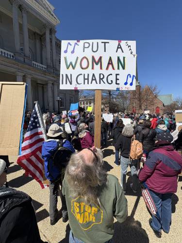 Rally participants protest the proposed Republican budget at the State House on Wednesday, April 9, 2025.