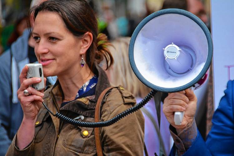 “If you’ve ever attended a protest march or political rally, you might be familiar with a call and response chant where a vocal activist, often with a megaphone, shouts to a crowd “Show me what democracy looks like,” writes Frizzell. “If you’ve ever attended a protest march or political rally, you might be familiar with a call and response chant where a vocal activist, often with a megaphone, shouts to a crowd “Show me what democracy looks like,” writes Frizzell.