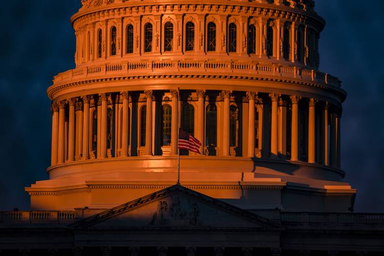 Sunlight begins to hit the dome of the U.S. Capitol on the morning of Jan. 17, 2021, in Washington, D.C.