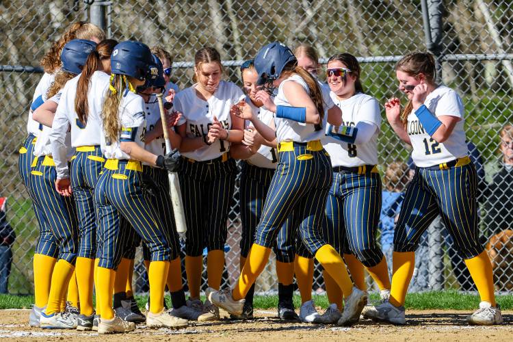 The Bow softball team celebrates as Lilly Wright (center) touches home plate after hitting a two-run homer at home on Monday. Wright helped lead the Falcons to a 5-4 victory over Campbell.