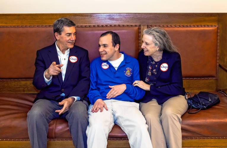 Phillip Kaneb waits in the hallway with his parents, Stephen and Andrea, as they get ready to testify against HB 1283 in the afternoon session at the State House on Wednesday.