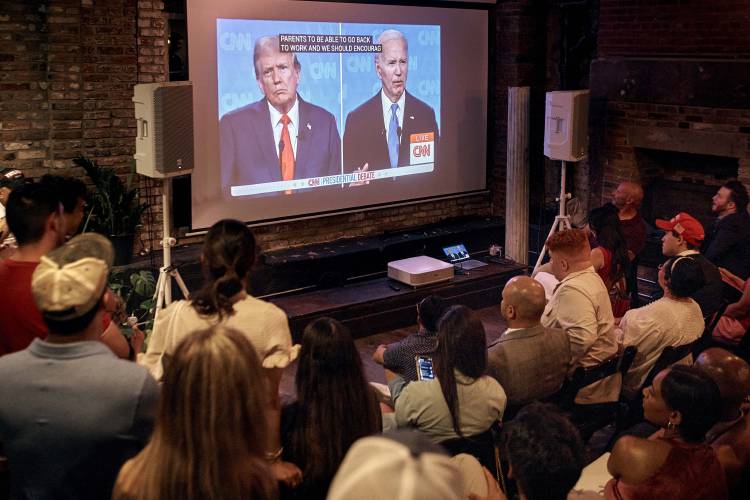 Trump supporters listen during the Young Republicans' presidential debate watch party on Thursday, June 27, 2024, in New York as President Joe Biden faces former President Donald Trump during the first presidential debate ahead of the 2024 elections. (AP Photo/Andres Kudacki)