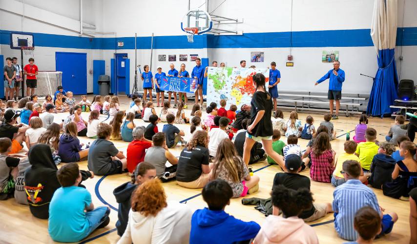 The Peace Run group talks to the children of the Boys and Girls Club abouth their mission before heading to Boston on Tuesday, August 13, 2024.