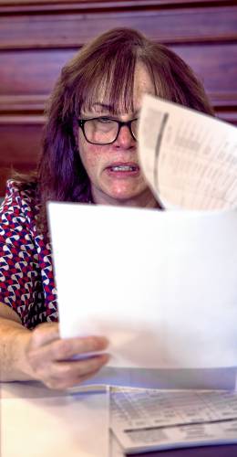 Tammy Duane of the Secretary of State audit team reads out the election numbers in the Executive Council chambers on Wednesday morning, November 6, 2024. 