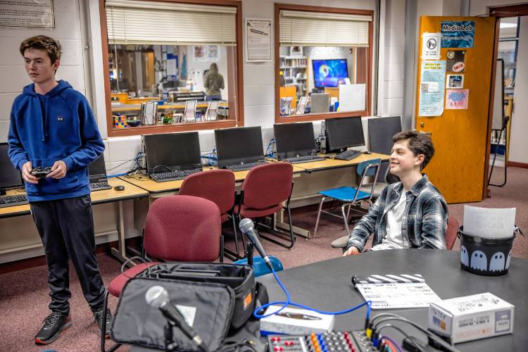 Bow players Carter Monroe (right) and  junior Matthew Kropp play a team from Texas at their epsorts match at the Bow High School library on Wednesday, November
