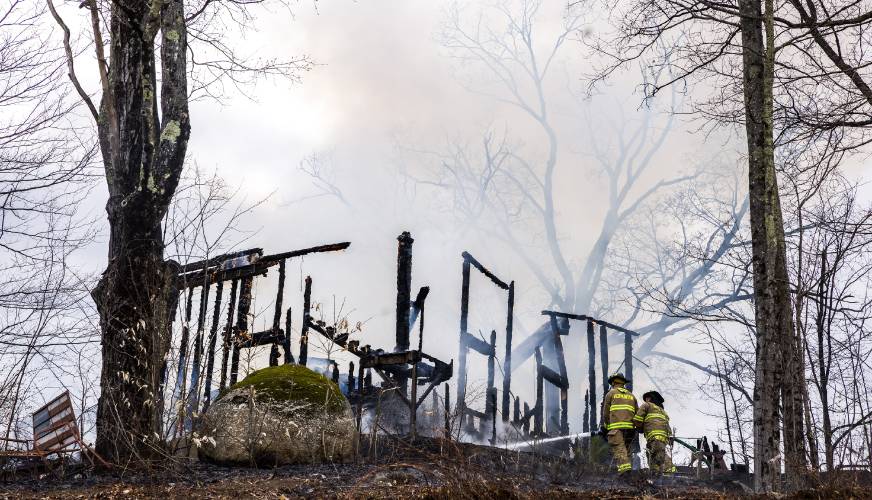 A fire at 100 Chase Farm Road in Hopkinton on Monday afternoon drew firefighters from around the area as flames spread from a garage to surrounding brush and fields.