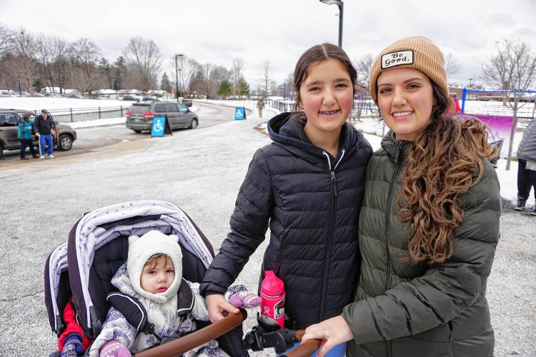 Rebecca Wolfe, right, brought her three children with her to vote in Concord, including 13-year-old Reagan, center, with Hadley and Nova in the stroller.