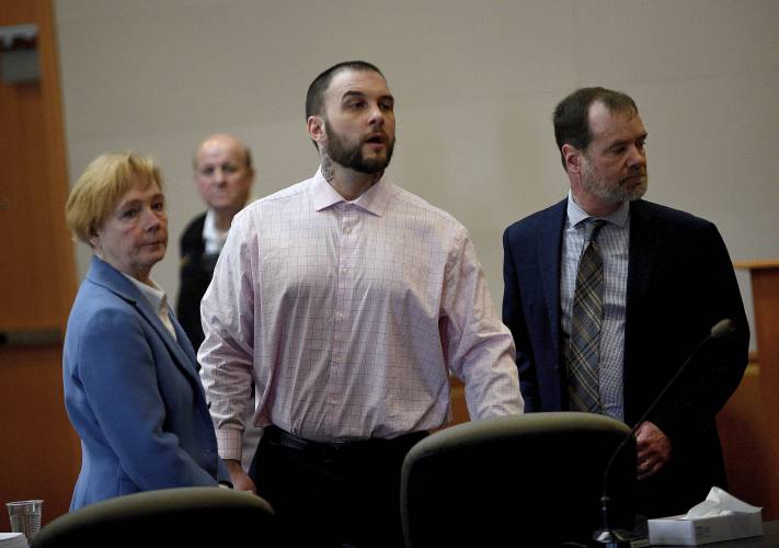 Adam Montgomery and his lawyers Caroline Smith and James Brooks watch as potential jurors enter the courtroom for jury selection ahead of his murder trial at Hillsborough County Superior Court in Manchester, N.H, on Tuesday, Feb. 6, 2024. Montgomery is accused of killing his 5-year-old daughter and spending months moving her body before disposing of it. (David Lane