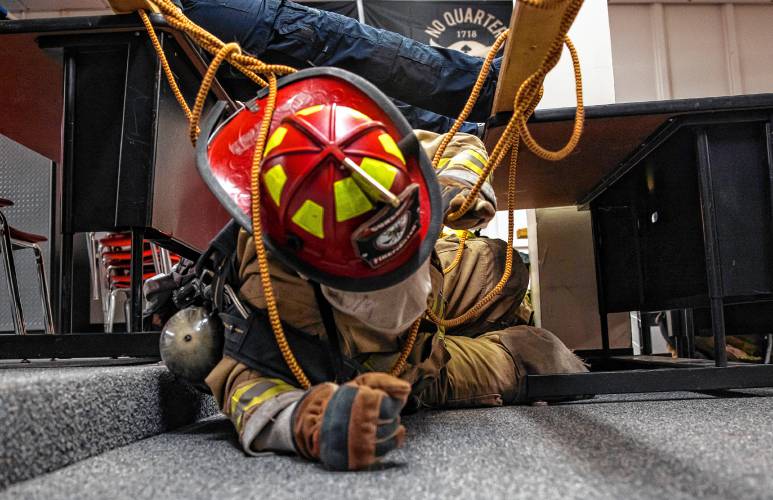 Addison Bergeron, a.k.a. Nails, leads the group through the obstacle course at their CRTC firefighter class at Concord High School on Thursday, March 7, 2024.