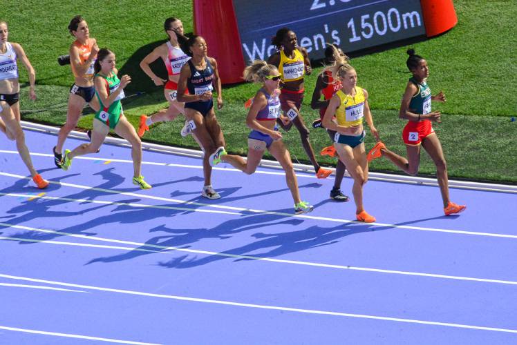 Elle St. Pierre (center, in sunglasses) competes in the women’s 1,500-meter semifinals at the Paris Games on Thursday. The UNH graduate finished third in her heat to advance to Saturday’s 12-athlete final.