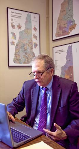 Secretary David Scanlan looks over the numbers for the New Hampshire election in his office on Wednesday morning, November 6, 2024. Scanlan thinks it will be another record turnout when all the numbers are in.