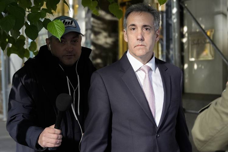 Michael Cohen leaves his apartment building on Monday on his way to Manhattan criminal court in New York. 