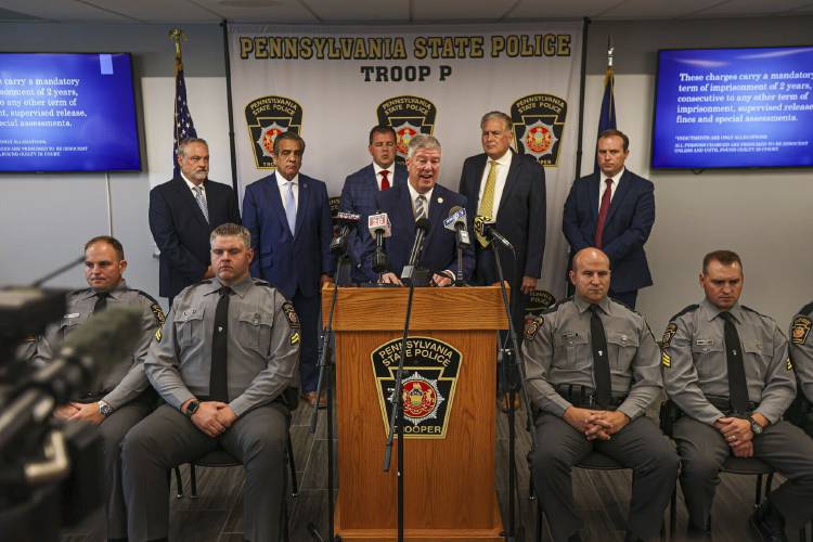 Pennsylvania Middle District U.S. Attorney Gerard Karam speaks at a news conference, Friday, July 12, 2024, in Wilkes-Barre, Pa. Authorities announced charges in a case in which gang members are accused of trafficking drugs and guns and using dating websites to lure victims, leading to four overdose deaths. (Jason Ardan/The Citizens' Voice via AP)
