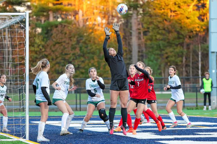 Pembroke goalie Laila Al-Shawafi leaps up to try to make a save amid pressure from Coe-Brown’s offense during Thursday's Division II semis.