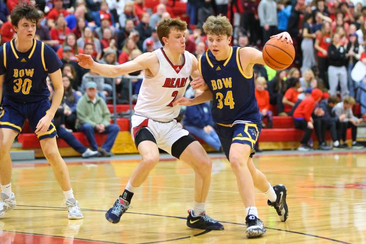 Bow’s Jake Reardon dribbles against Coe-Brown’s Connor Bagnell in a preliminary round tournament game on March 1. Both Reardon and Bagnell are back for their respective teams this season.