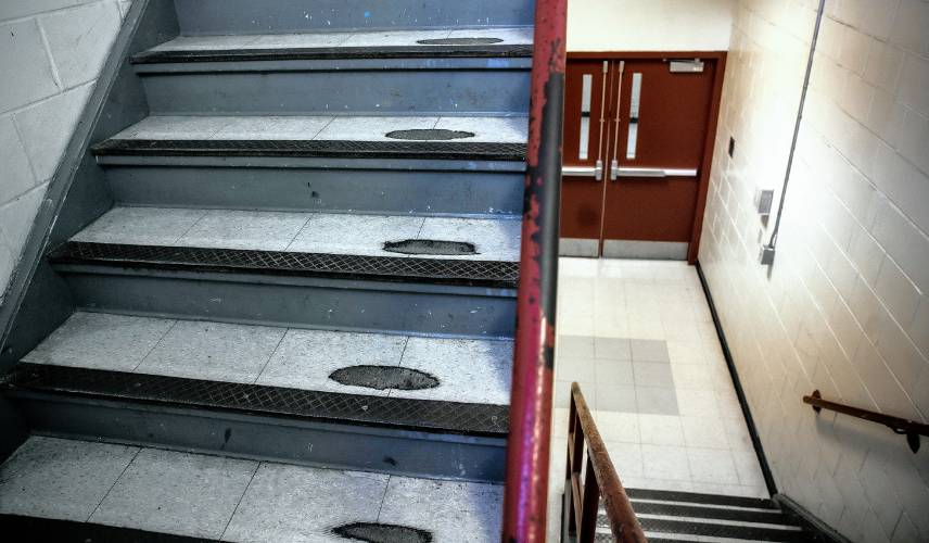 Beyond the structural issues inside Rundlett Middle School, little details show its age. On the right side of this staircase, more than 60 years of foot traffic have worn divots down to the concrete. 
