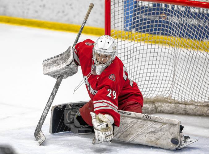 Concord goaltender Carter Heise makes a kick save in the first period of the Brian C. Stone Memorial Christmas Tournament final on Saturday at JFK Coliseum in Manchester. Concord won the title with a 3-1 victory over Exeter.