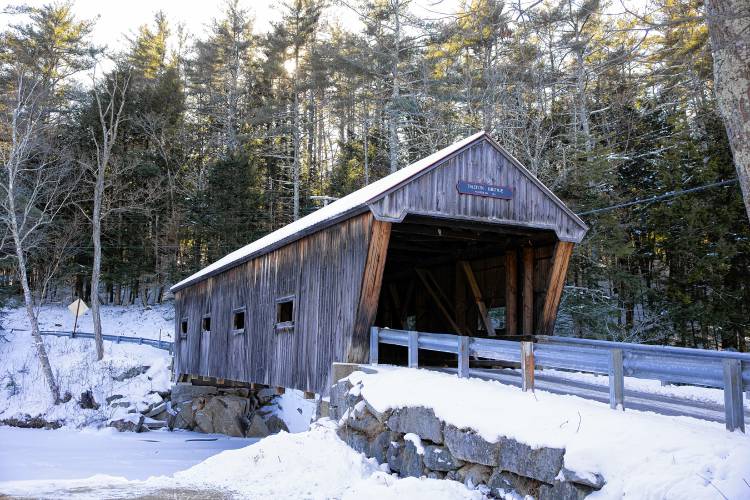The Dalton covered bridge over the Warner River near the Warner River in downtown.