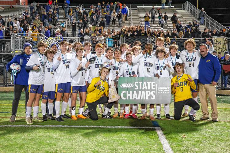The Bow Falcons celebrate their first ever Division II boys’ soccer championship after beating Lebanon, 2-1, at Stellos Stadium in Nashua on Friday.