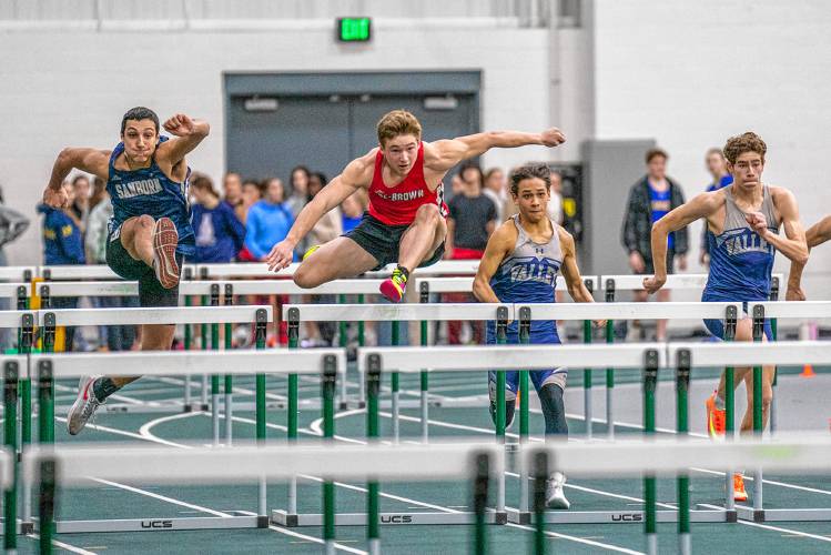 Coe-Brown’s Cameron Lee (second from left) clears a hurdle on his way to the win in the 55-meter hurdles on Saturday at Plymouth State. Lee won the hurdles in 8.69 seconds and also scored in the 300 meters to help lead Coe-Brown to the team victory in a 20-team meet.